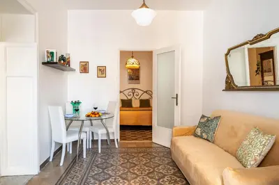 a living room with a couch and a table at Piano Imperiale Home in Palermo