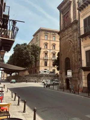 an empty street in a city with a building at Manuè's House in Palermo