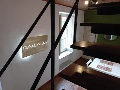 a set of stairs with a sign on a wall at Targa Moto Art in Palermo
