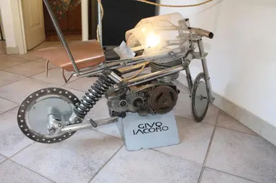 an old motorcycle is on display in a room at Targa Moto Art in Palermo