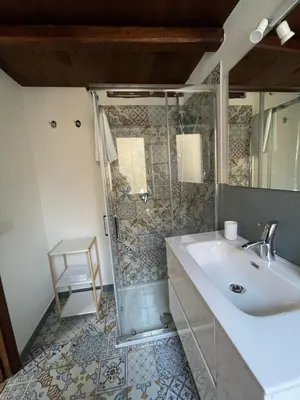 a bathroom with a shower and a sink at Casa di Reginaldo al Capo in Palermo