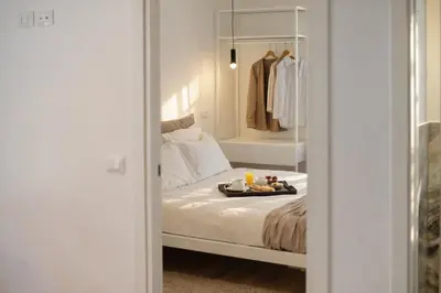 an empty hallway with a door and a long corridor at Residenza Ximenes Hub in Palermo