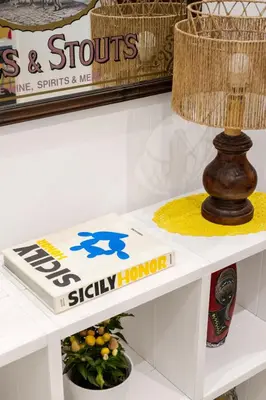 a white table with a lamp on top of it at Pusamonti Central Flat in Palermo