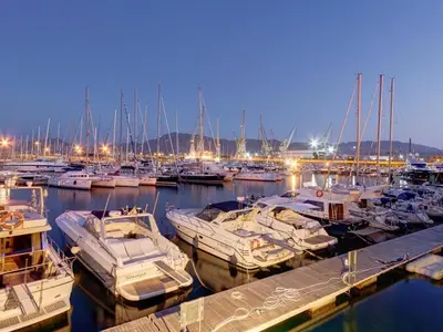 a bunch of boats docked in a marina at night at Casa Aurora G in Palermo