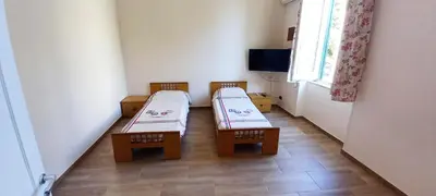 a room with two benches in a room with a window at Casa Aurora G in Palermo