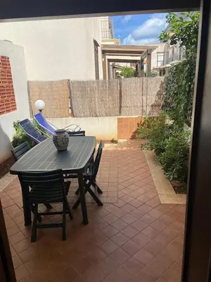 a patio with a table and chairs on a patio at San Vito Suite Apartament in San Vito lo Capo