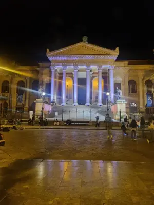 a large building at night with lights at Cortile Benso Guest House in Palermo