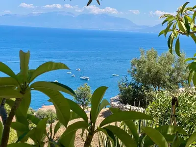 a view of the ocean with boats in the water at La Perla d'Argento in Santa Flavia