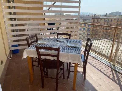 a bed with towels on top of it at panorama home central in Palermo
