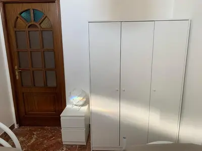 a bathroom with a sink and a mirror at panorama home central in Palermo