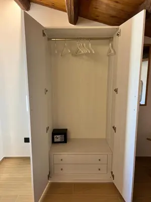a closet with a shelf and a clock in it at Villa Clori in Trabia