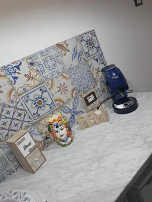 a table with a camera and other items on it at Maddy Luxury Apartment in Palermo