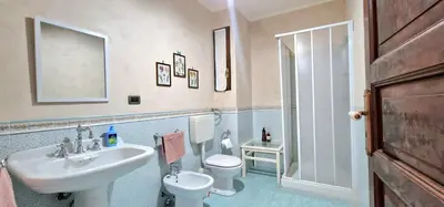 a bathroom with a sink and a toilet at Casa De Gasperi in Castellammare del Golfo