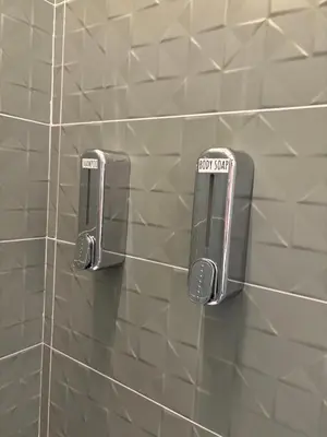 two towels on a tiled wall in a bathroom at Giulia's Apartment in Altavilla Milicia