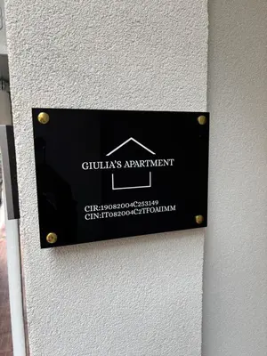 a sign on the side of a building at Giulia's Apartment in Altavilla Milicia