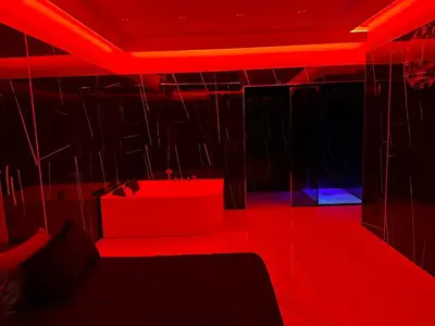 a room with red lights on the ceiling at Luxurymimi in Palermo