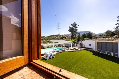 a view from a window of a yard with a pool at Villa Casty with private pool in Trabia