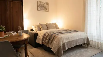 a bedroom with a bed and a dresser and a mirror at Via del Bastione in Palermo