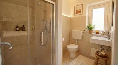 a bedroom with a bed in a white room at Via del Bastione in Palermo