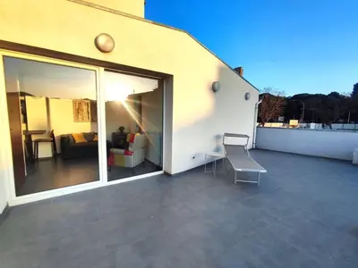 a balcony with a view of a living room at QASA apartment with terrace, Palermo center in Palermo