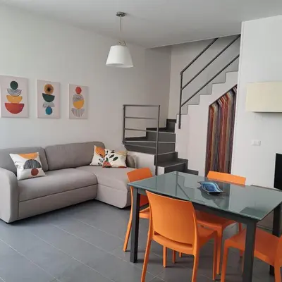 a living room with a couch and a table at CasaLavinaro in Castellammare del Golfo