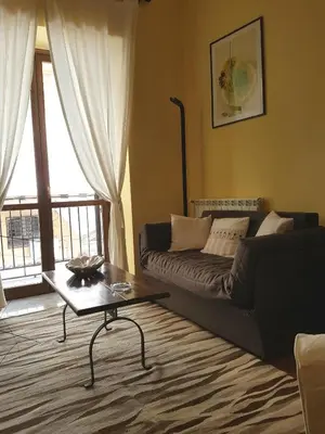 a living room with a couch and a coffee table at La Casetta del Vicolo in Palermo