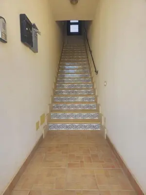 a staircase in a building with a stair case at David's Apartment in San Vito lo Capo
