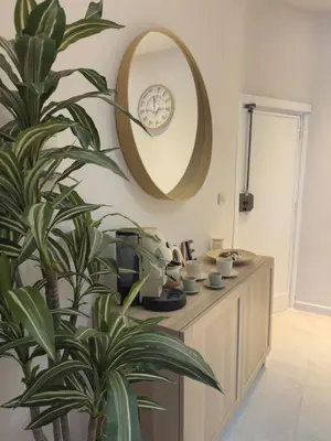 a bathroom with a mirror and a potted plant at Casa Tulum - Sea View & Breakfast in Palermo