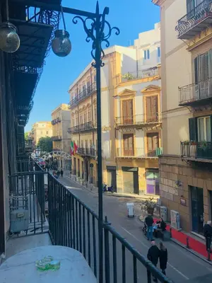 a view from a balcony of a street with buildings at Apartment Via Vittorio Emanuele & Vucciria in Palermo