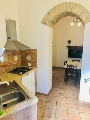 a kitchen with a sink and a stove top oven at Apartment Via Vittorio Emanuele & Vucciria in Palermo