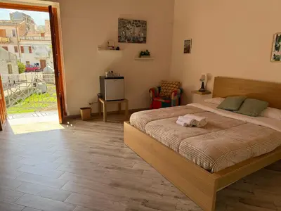 a bedroom with a bed with a towel on it at Risvegliarsi a Danisinni in Palermo