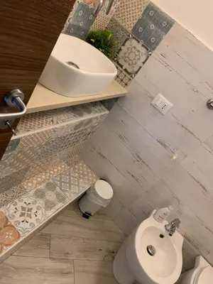 a bathroom with a sink and a toilet at Risvegliarsi a Danisinni in Palermo