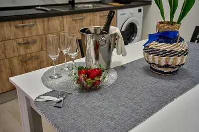 a table with plates and wine glasses on it at Harmony Lux in Bagheria