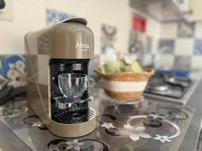 a coffee maker sitting on top of a kitchen counter at Arco Apartment in Bagheria
