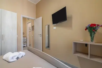 a bathroom with a toilet and a sink at GuestHost - Ballarò Flat dei Sovrani x6 in Palermo