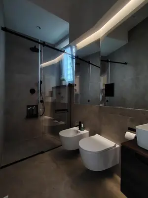 a bathroom with a toilet and a sink and a shower at Cappuccetto Rosso Sweet Apartment Palermo in Palermo