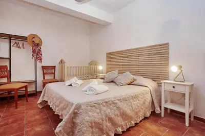 a bedroom with a large bed with towels on it at villa oasi scopello in Castellammare del Golfo