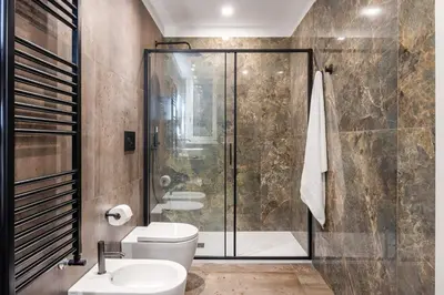 a bathroom with a shower and a toilet and a sink at Casta Diva Fervore Apartments Self Check-in in Palermo