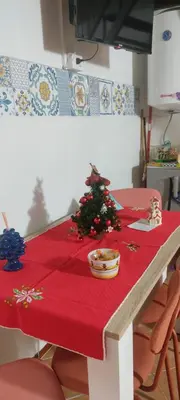 a table with a christmas tree on top of it at Ballarua in Palermo