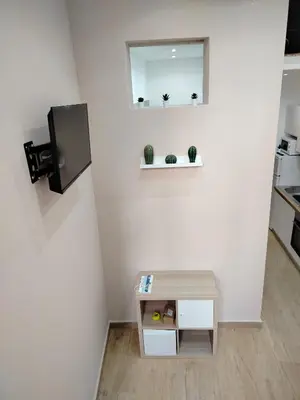 a room with a table and a mirror on the wall at Casa mattya in Palermo