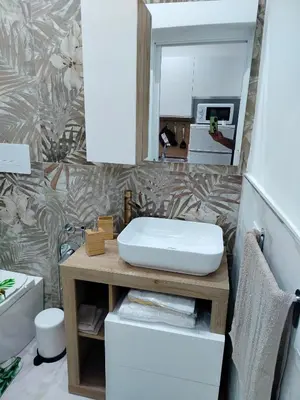 a bathroom with a sink and a mirror at Casa mattya in Palermo