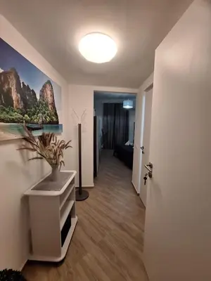a hallway with a room with a plant on a wall at Tra I Normanni E Cattedrale Apartament Palermo in Palermo