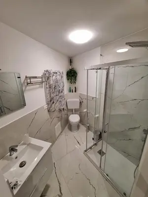 a bathroom with a shower and a toilet and a sink at Tra I Normanni E Cattedrale Apartament Palermo in Palermo