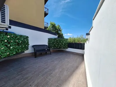 a patio with a bench on the side of a building at Tra I Normanni E Cattedrale Apartament Palermo in Palermo