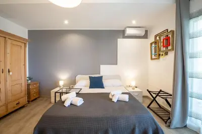 a bedroom with a bed with two pillows on it at Villa Amelia in Castellammare del Golfo