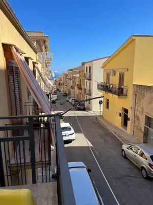 a view of a kitchen and a living room at Animami Mare in Castellammare del Golfo