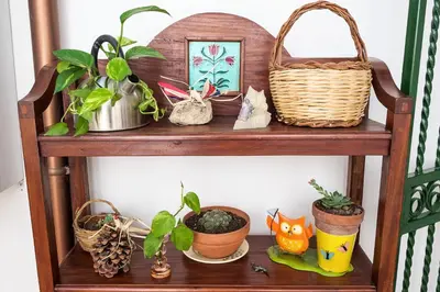 a wooden shelf with plants and baskets on it at MAD Bed & Breakfast in Palermo