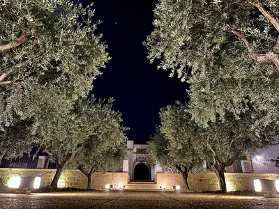 a building with a door in the middle of trees at Villa Mediterranea in Carini