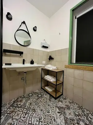 a bathroom with a sink and a mirror at Villa Mediterranea in Carini