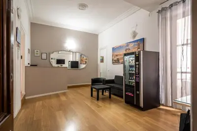 a living room with a soda machine in a room at B&b Glamour in Palermo
